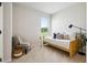 Cozy bedroom with a twin bed, throw pillows, side table, accent chair, and a sunlit window at 3000 Winding Grove Ln, Moncks Corner, SC 29461