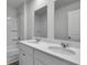 Bathroom with double sink vanity, modern fixtures, and tub/shower combo with white tile surround at 220 Maple Hill Dr, Moncks Corner, SC 29461