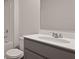 Bright bathroom featuring a white vanity, sink, and framed mirror above the toilet and shower at 127 Morning View Way, Moncks Corner, SC 29461