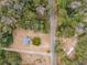 Aerial showing home, expansive lot, and surrounding trees at 8375 Shell House Rd, Edisto Island, SC 29438