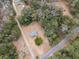 House nestled in a wooded area with a long driveway at 8375 Shell House Rd, Edisto Island, SC 29438