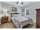 Bright bedroom with a full bed and ceiling fan at 8375 Shell House Rd, Edisto Island, SC 29438