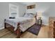 Cozy bedroom with a full-size bed and wood dresser at 8375 Shell House Rd, Edisto Island, SC 29438