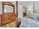Bedroom with wooden dresser and post bed at 8375 Shell House Rd, Edisto Island, SC 29438