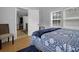 Bedroom with blue and white bedding and view of kitchen at 8375 Shell House Rd, Edisto Island, SC 29438