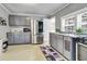 Gray kitchen with stainless steel appliances and granite countertops at 8375 Shell House Rd, Edisto Island, SC 29438