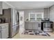 Stainless steel appliances and gray cabinets in this galley kitchen at 8375 Shell House Rd, Edisto Island, SC 29438