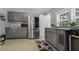 Modern kitchen featuring stainless steel appliances and gray cabinets at 8375 Shell House Rd, Edisto Island, SC 29438