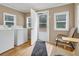 Laundry room with washer, dryer, and exterior access at 8375 Shell House Rd, Edisto Island, SC 29438