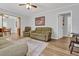 Living Room with olive green couch and wood flooring at 8375 Shell House Rd, Edisto Island, SC 29438