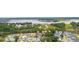 Aerial view of houses near the water with bridge in the background at 1157 Oak Bluff Ave, Charleston, SC 29492