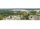 Aerial view of houses near the water with bridge in the background at 1157 Oak Bluff Ave, Charleston, SC 29492