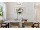 Dining room with a light-colored table and wicker chairs at 1157 Oak Bluff Ave, Charleston, SC 29492