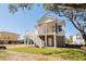 White house with large deck, stairs, and screened porch at 1157 Oak Bluff Ave, Charleston, SC 29492