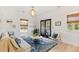 Bright living room with comfy sofas, rug, and French doors at 1157 Oak Bluff Ave, Charleston, SC 29492