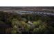House nestled in trees near water with many other houses visible at dusk at 633 Barbados Dr, Charleston, SC 29492