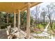 Serene back porch overlooking a lush landscape and waterfront at 633 Barbados Dr, Charleston, SC 29492