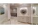 Bright bathroom with a vanity, large mirror, and access to hallway at 633 Barbados Dr, Charleston, SC 29492