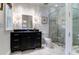 Stylish bathroom with dark vanity and frameless glass shower at 633 Barbados Dr, Charleston, SC 29492