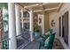 Inviting front porch with rocking chairs and a view of the main entrance at 633 Barbados Dr, Charleston, SC 29492
