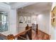 Bright hallway featuring wood floors and window with plantation shutters at 633 Barbados Dr, Charleston, SC 29492