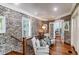 Charming landing area with exposed brick and hardwood floors at 633 Barbados Dr, Charleston, SC 29492