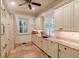 Bright laundry room with custom cabinetry and tiled flooring at 633 Barbados Dr, Charleston, SC 29492