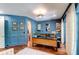 Elegant home office with large desk and blue walls at 633 Barbados Dr, Charleston, SC 29492