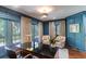 Home office with built-in shelving and hardwood floors at 633 Barbados Dr, Charleston, SC 29492