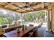 Covered outdoor kitchen with dining area and built-in grill at 633 Barbados Dr, Charleston, SC 29492