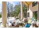 Spacious patio with wicker furniture, offering a relaxing poolside view at 633 Barbados Dr, Charleston, SC 29492