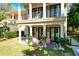 Relaxing patio with pink chairs and lush greenery at 633 Barbados Dr, Charleston, SC 29492