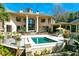 Luxury pool and patio with lush landscaping and stonework at 633 Barbados Dr, Charleston, SC 29492