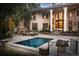 Tranquil pool and patio area, complete with a stone fireplace at 633 Barbados Dr, Charleston, SC 29492