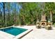 Tranquil pool and spa with stone fireplace and comfortable seating at 633 Barbados Dr, Charleston, SC 29492