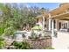 Large pool with patio, outdoor kitchen, and lush landscaping at 633 Barbados Dr, Charleston, SC 29492