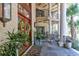 Grand entrance with covered porch, columns, and lush landscaping at 633 Barbados Dr, Charleston, SC 29492