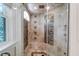 Large walk-in shower with multiple shower heads and tiled walls at 633 Barbados Dr, Charleston, SC 29492