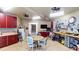 Organized workshop with red cabinets, workbench, and tools at 633 Barbados Dr, Charleston, SC 29492