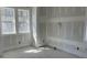 Spacious bedroom with large windows providing natural light and neutral wall paint at 1552 John Fenwick Ln, Johns Island, SC 29455