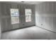 Bedroom with two windows providing ample light at 1556 John Fenwick Ln, Johns Island, SC 29455
