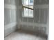 Cozy bedroom with a window view of the neighboring homes and lush greenery at 1556 John Fenwick Ln, Johns Island, SC 29455