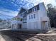 Beautiful home with a covered porch and exterior design against a beautiful sky at 1556 John Fenwick Ln, Johns Island, SC 29455