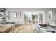 Open dining area with hardwood floors, access to deck, and natural light at 3806 Cameron Blvd, Isle of Palms, SC 29451