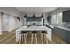 Modern kitchen with gray cabinetry, large island, and white countertops at 3806 Cameron Blvd, Isle of Palms, SC 29451