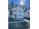 Two-story white house with gray door, two-car garage, and front yard at 228 Claret Cup Way, Charleston, SC 29414