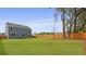 Expansive green backyard with a wood fence and mature trees provides ample outdoor space at 142 Morning View Way, Moncks Corner, SC 29461
