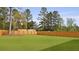 A spacious backyard features a wooden fence and manicured lawn at 142 Morning View Way, Moncks Corner, SC 29461