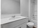A bathroom features a vanity with a sink, toilet, and shower-tub combo at 142 Morning View Way, Moncks Corner, SC 29461