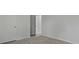 A bedroom features neutral walls, carpeted flooring, and an open doorway at 142 Morning View Way, Moncks Corner, SC 29461